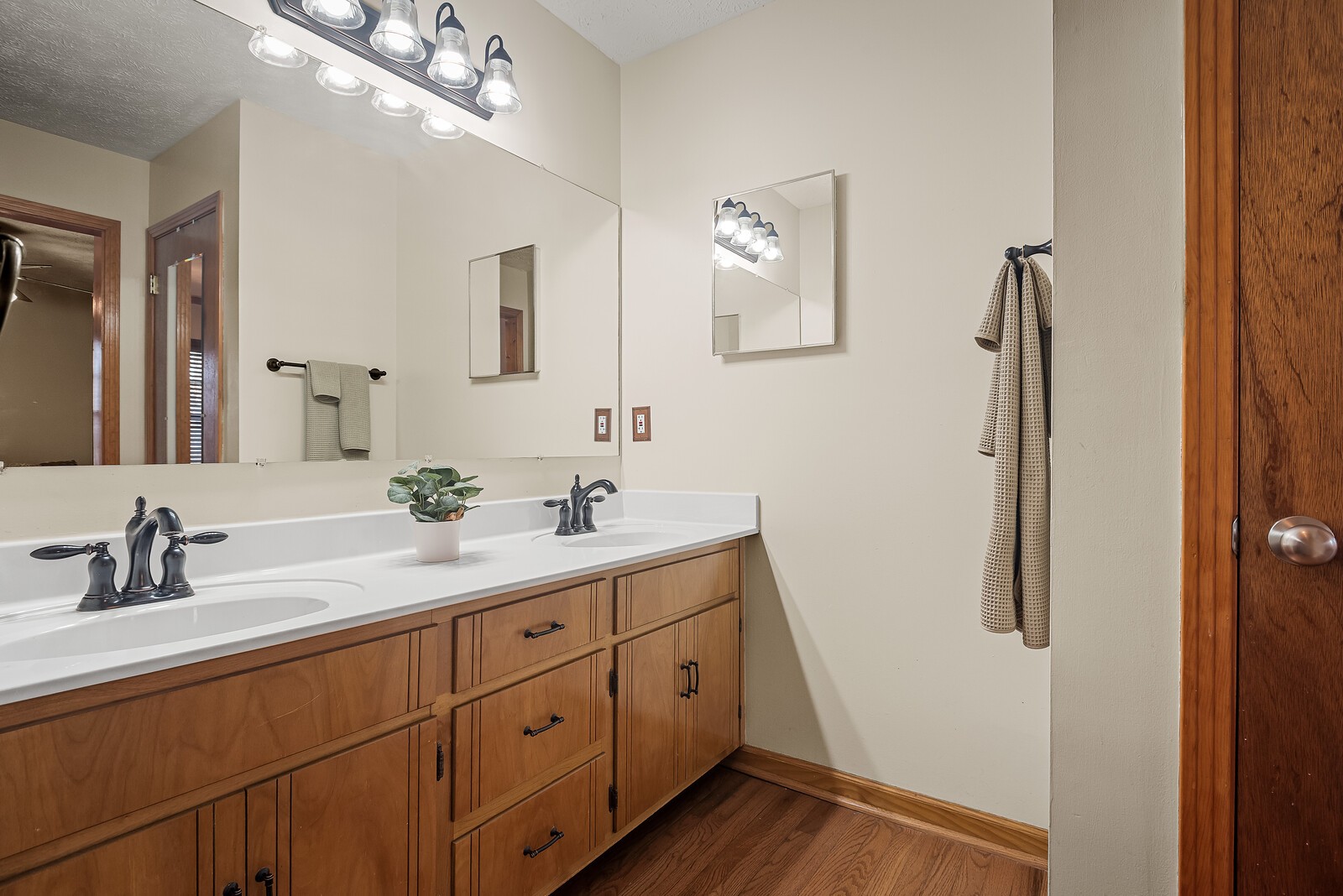 2427 Toler Road Woodlawn, TN 37191 - Photo 27 of 48 a bathroom with a double vanity sink a mirror and shower