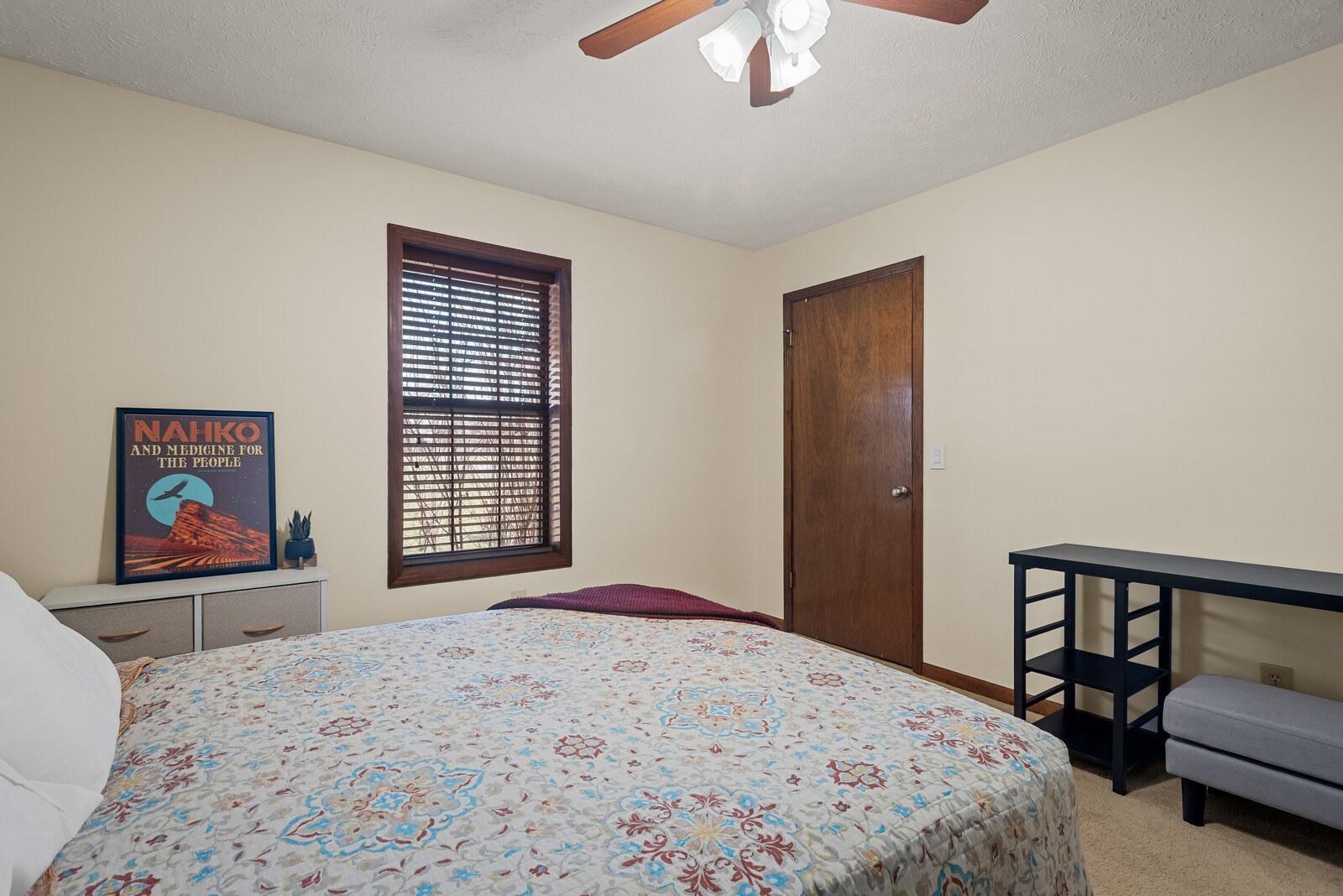 2427 Toler Road Woodlawn, TN 37191 - Photo 33 of 48 a bedroom with a bed and a chandelier