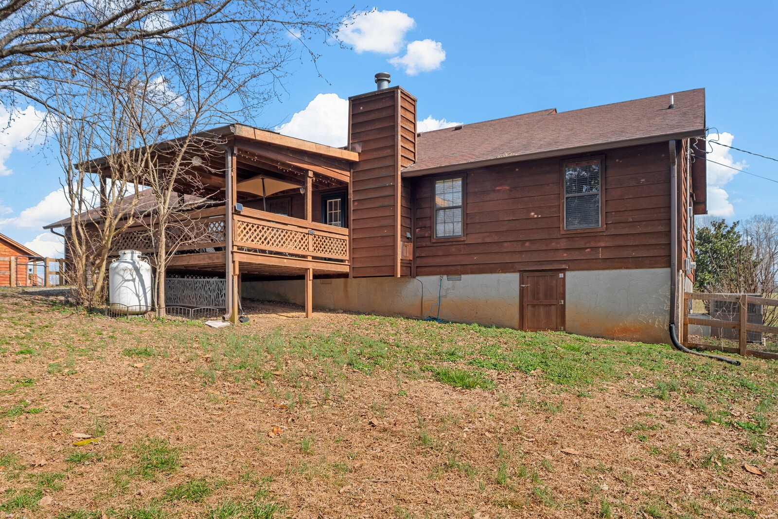 2427 Toler Road Woodlawn, TN 37191 - Photo 41 of 48 a front view of a house with a yard