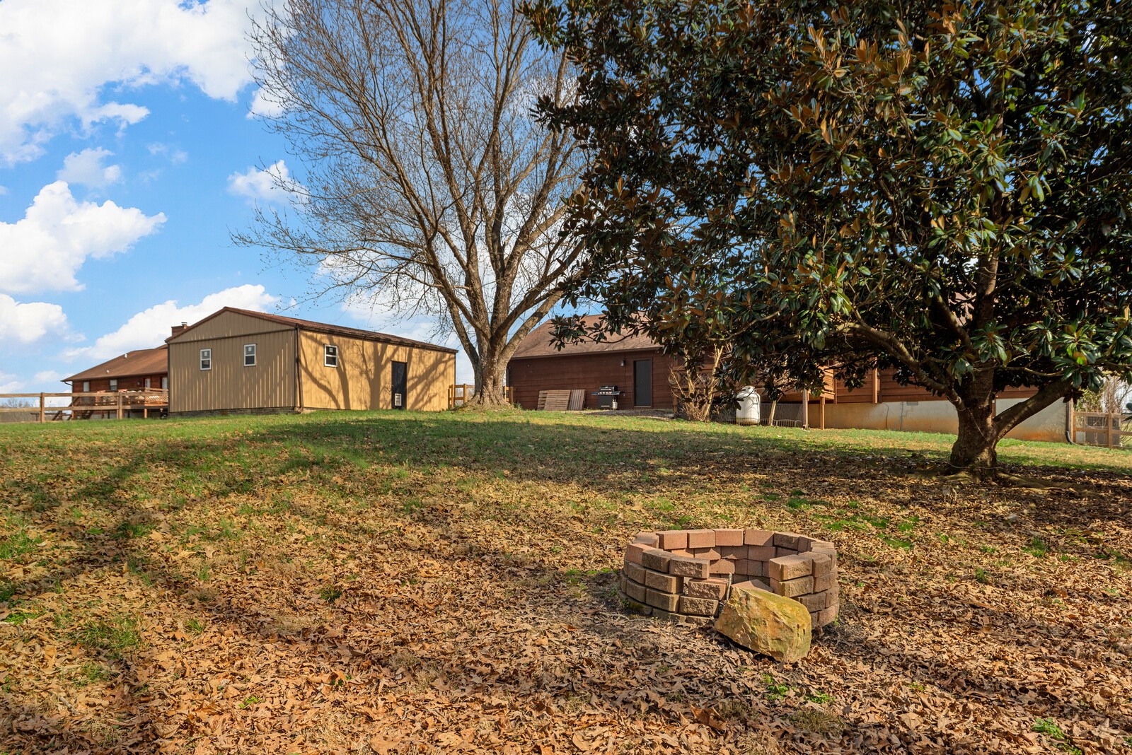 2427 Toler Road Woodlawn, TN 37191 - Photo 43 of 48 a front view of a house with garden
