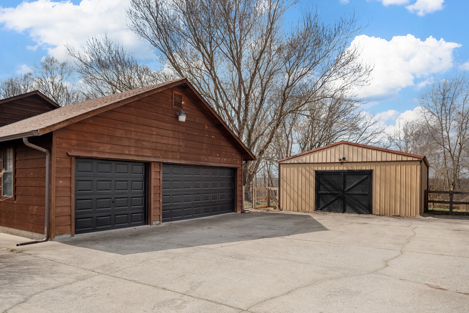2427 Toler Road Woodlawn, TN 37191 - Photo 45 of 48 a view of a house with a yard and garage