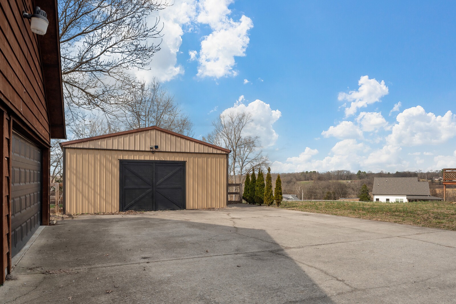 2427 Toler Road Woodlawn, TN 37191 - Photo 46 of 48 a front view of a house with garden
