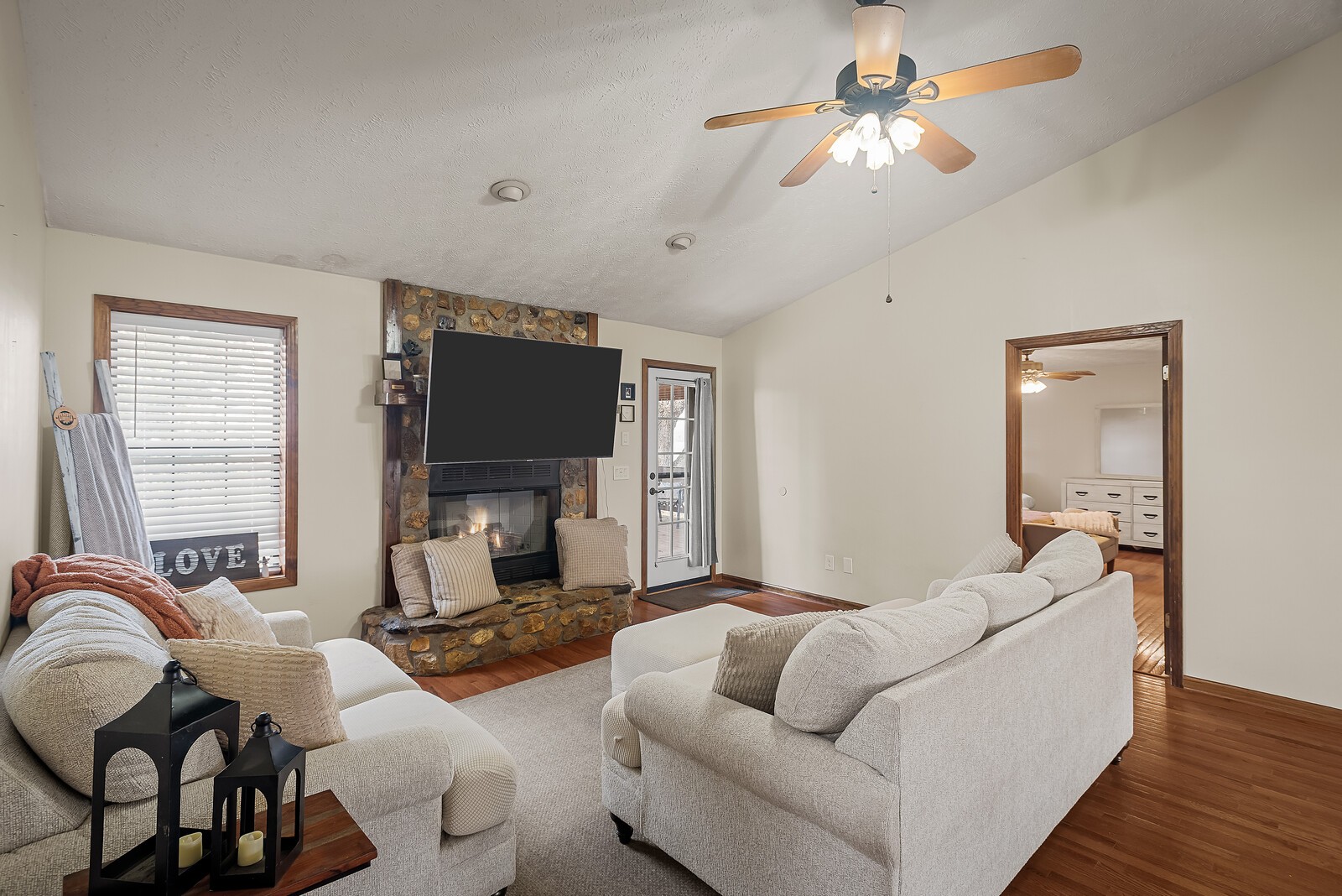 2427 Toler Road Woodlawn, TN 37191 - Photo 10 of 48 a living room with furniture and a flat screen tv