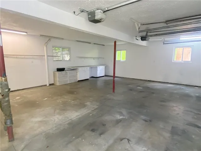 a view of a big room with closet and windows