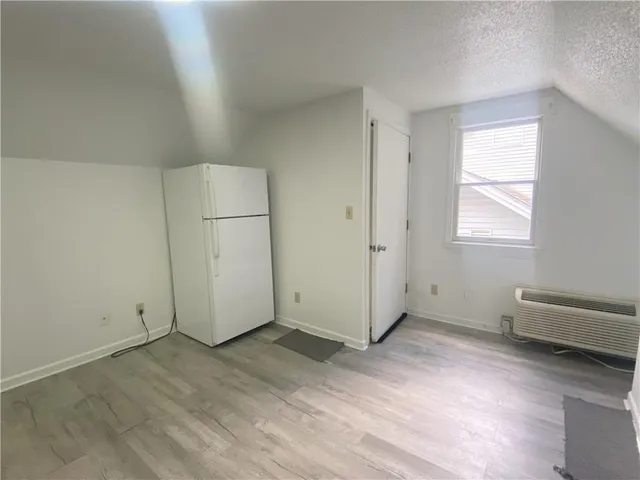 a kitchen with stainless steel appliances a white stove top oven sink and cabinets