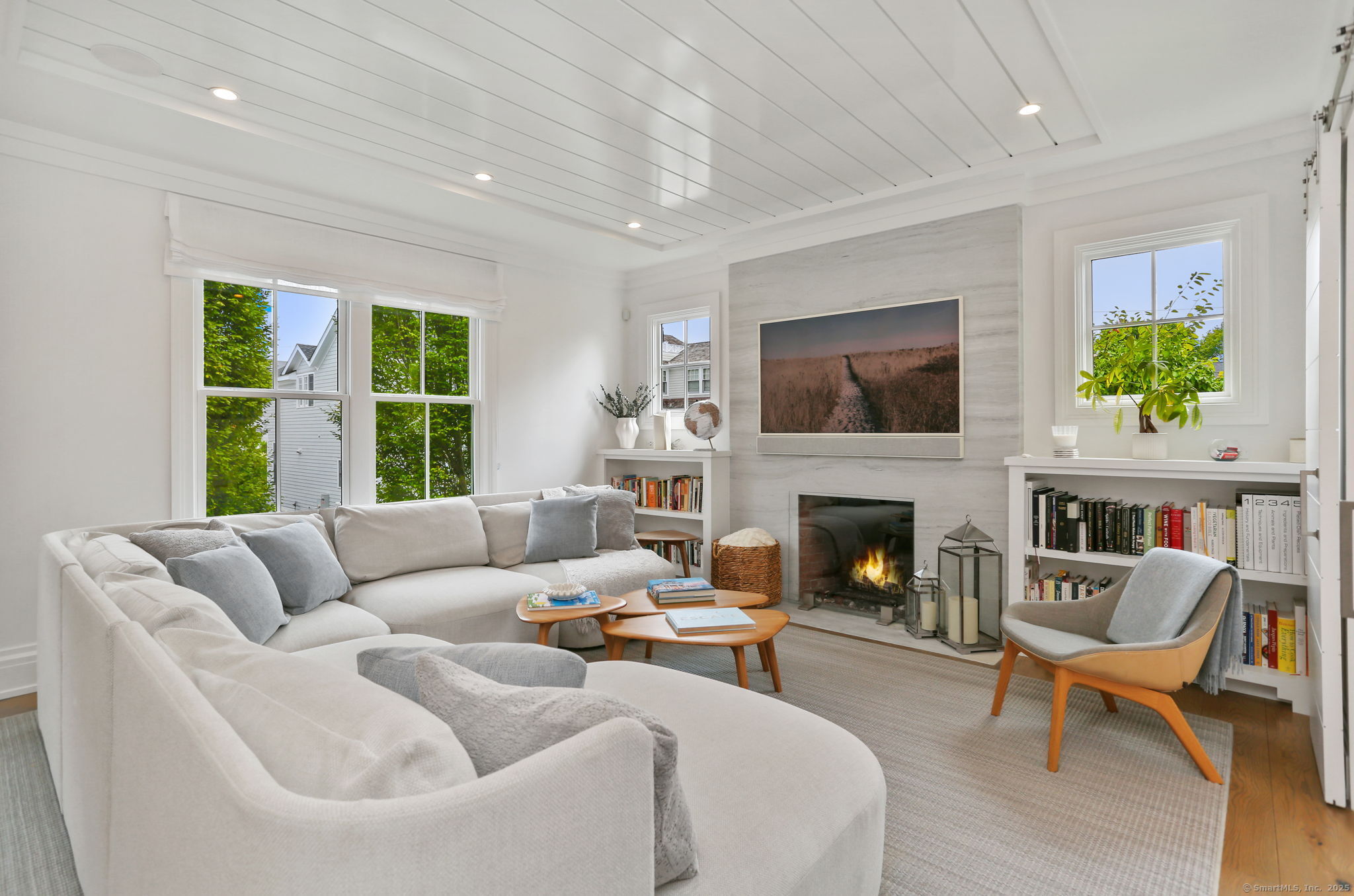 28 Norwalk Avenue Westport, CT 06880 - Photo 11 of 36 a living room with furniture fireplace and a large window