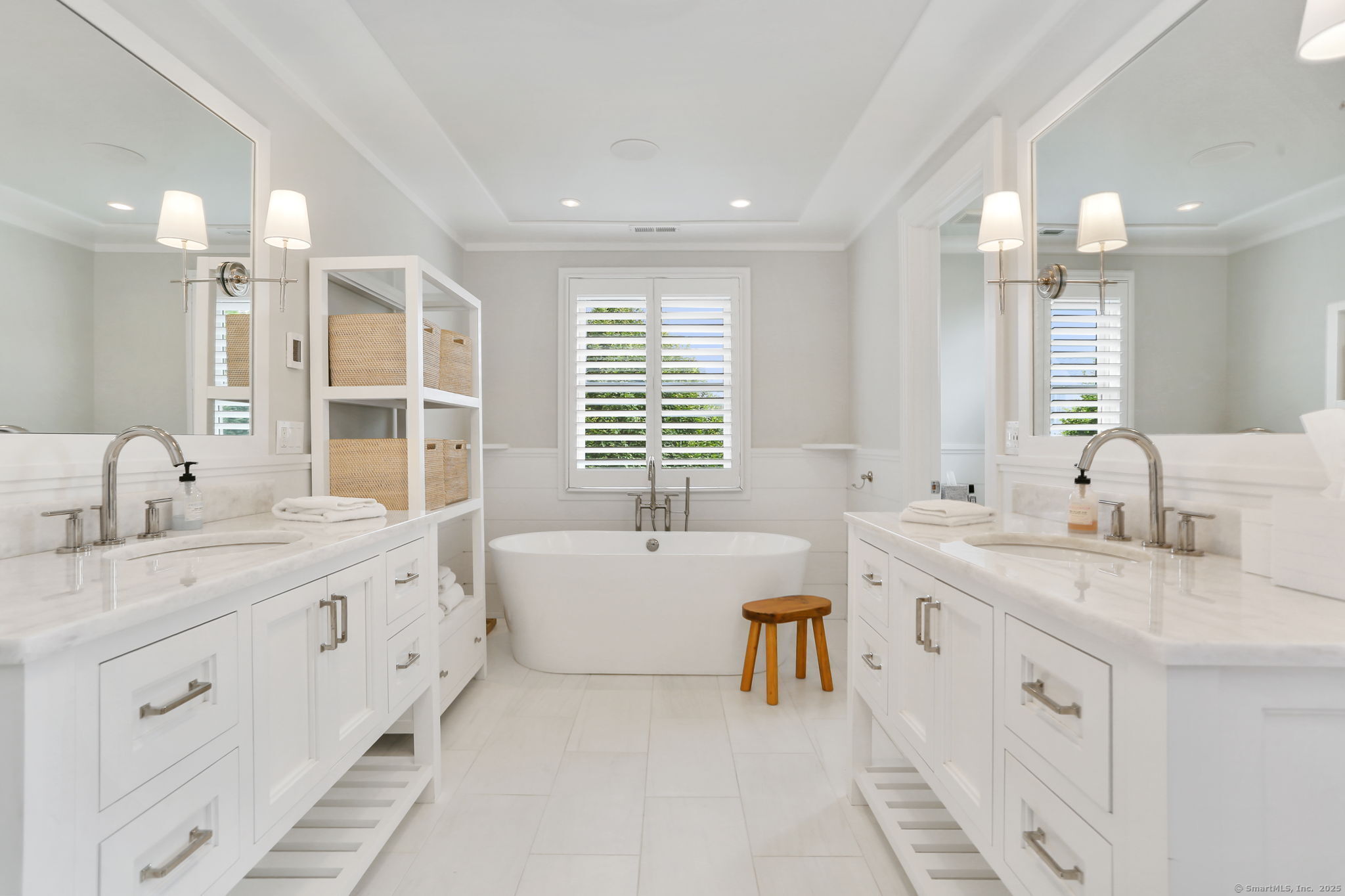 28 Norwalk Avenue Westport, CT 06880 - Photo 18 of 36 a bathroom with a granite countertop sink double vanity granite tub and a large mirror