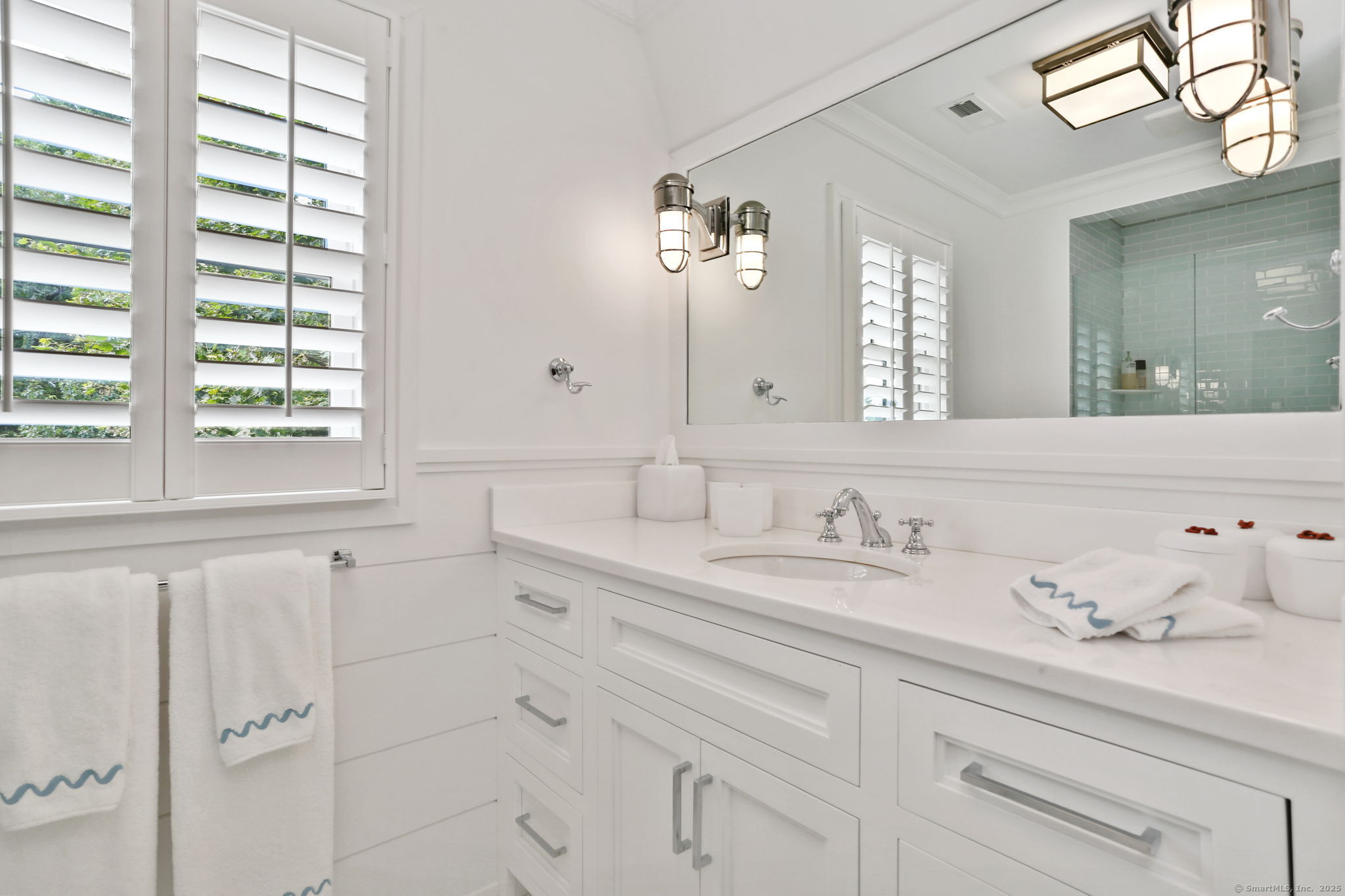 28 Norwalk Avenue Westport, CT 06880 - Photo 22 of 36 a bathroom with a sink and a mirror