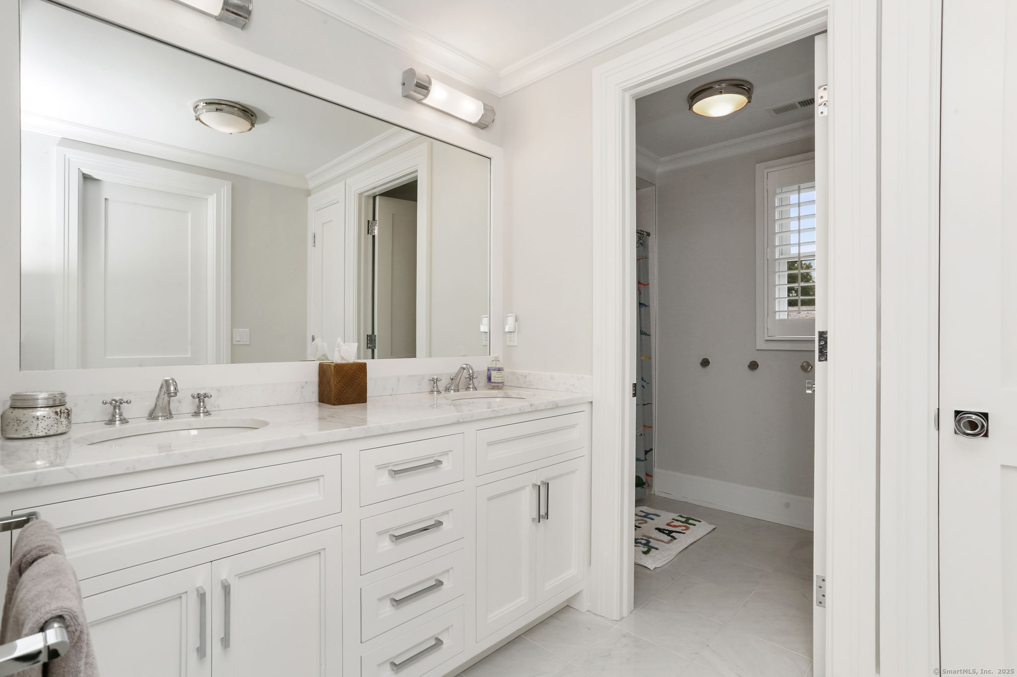 28 Norwalk Avenue Westport, CT 06880 - Photo 25 of 36 a bathroom with a sink double vanity and a mirror