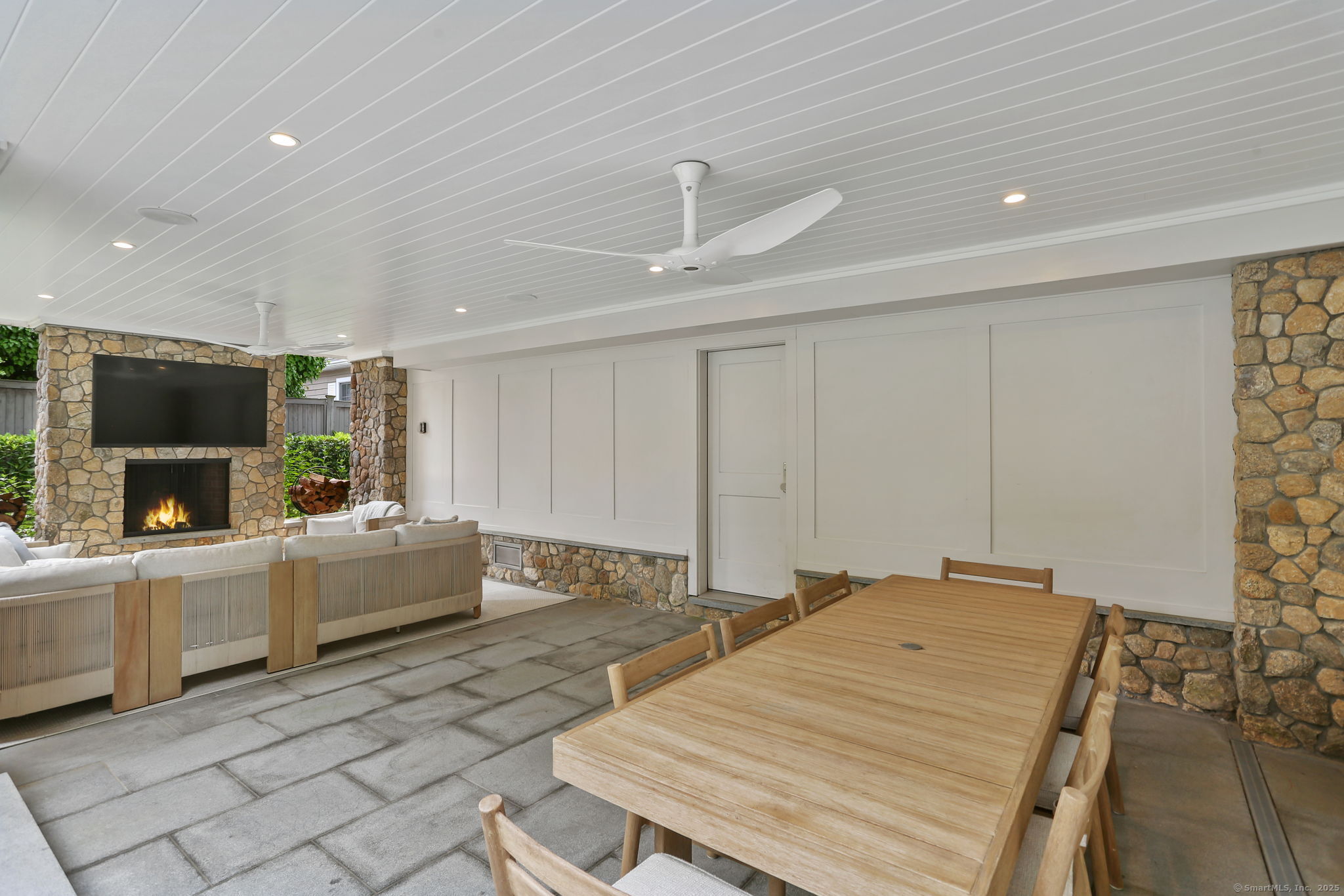 28 Norwalk Avenue Westport, CT 06880 - Photo 33 of 36 a living room with fireplace furniture and a flat screen tv