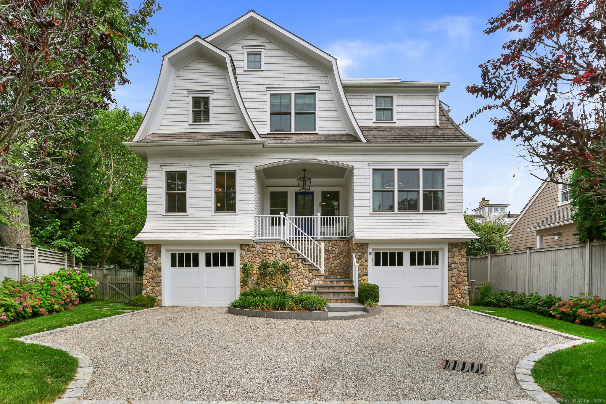 28 Norwalk Avenue Westport, CT 06880 - Photo 36 of 36 a front view of a house with a yard and outdoor seating