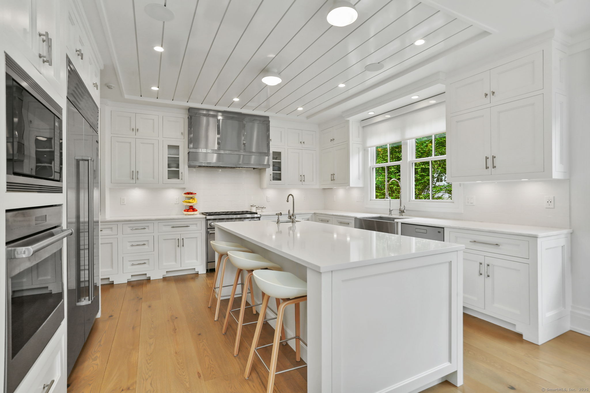 28 Norwalk Avenue Westport, CT 06880 - Photo 7 of 36 a kitchen with a sink stove and cabinets