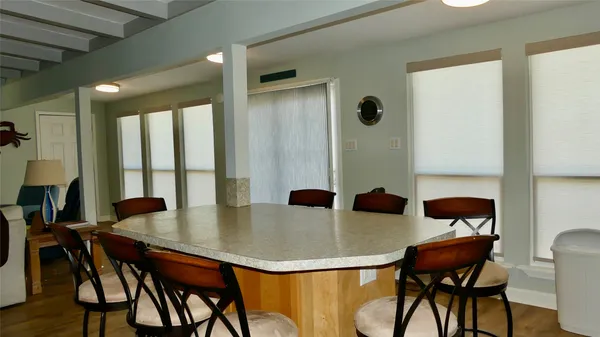 a dining room with furniture and window