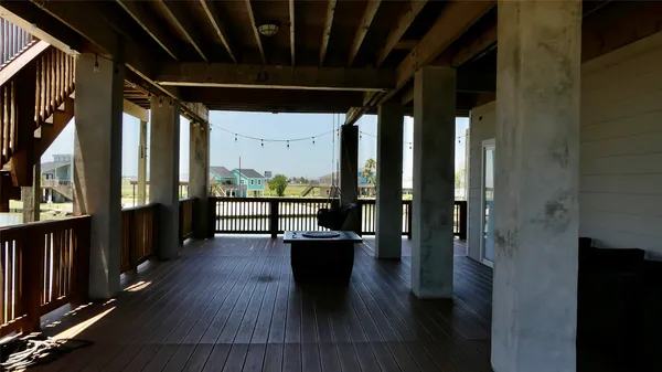 a view of a balcony with wooden floor