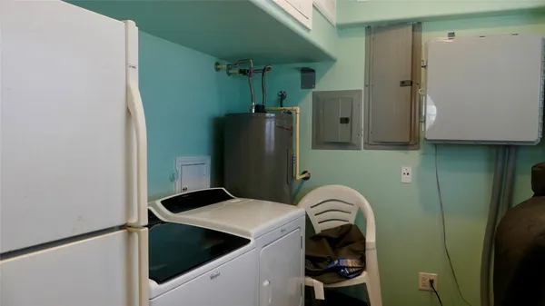 a view of a lake with boats and trees in the background