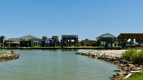 a view of a lake with a large house