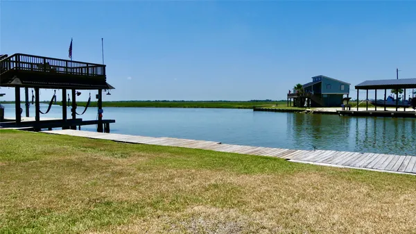 a view of a lake with a house in the background