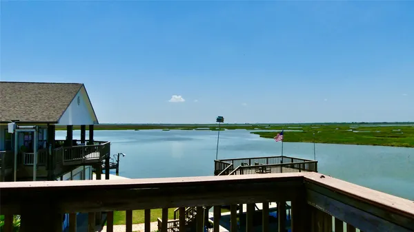 a view of a balcony with two chairs