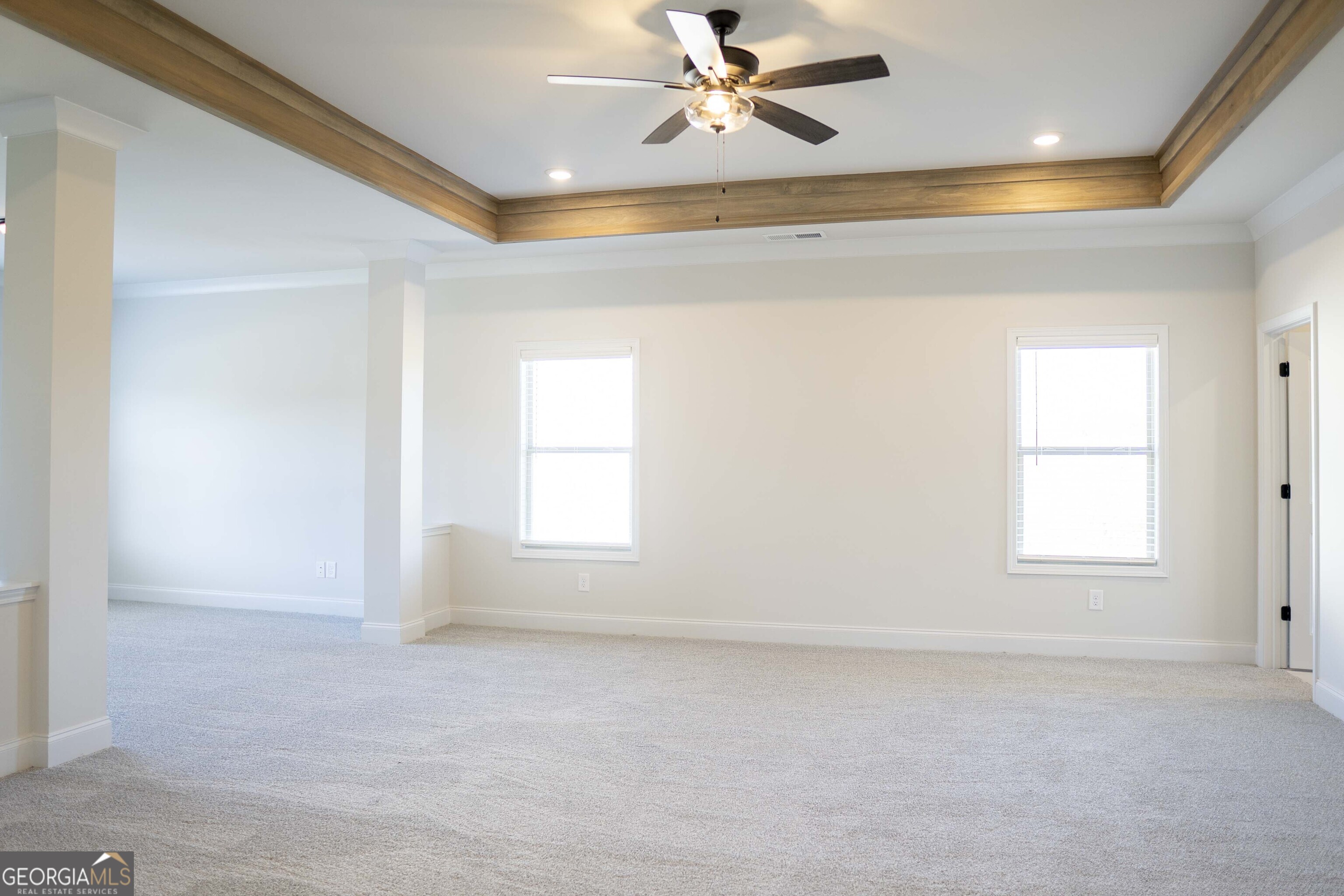 600 Beaver Court Perry, GA 31069 - Photo 30 of 48 en empty room with windows and ceiling fan