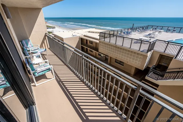 a view of balcony with furniture