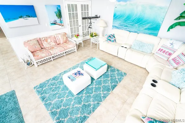 a living room with furniture and a rug