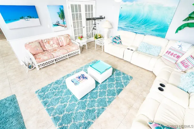 a living room with furniture and a rug