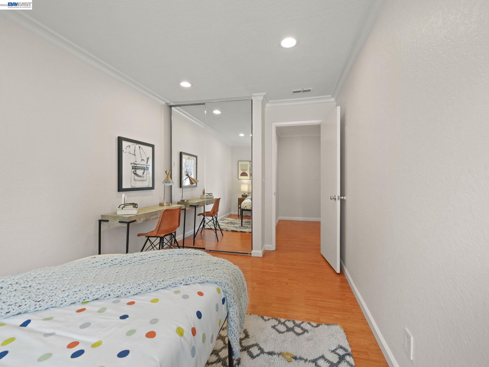 1972 Briscoe Terrace Fremont, CA 94539 - Photo 13 of 27 a bedroom with a bed and wooden floor