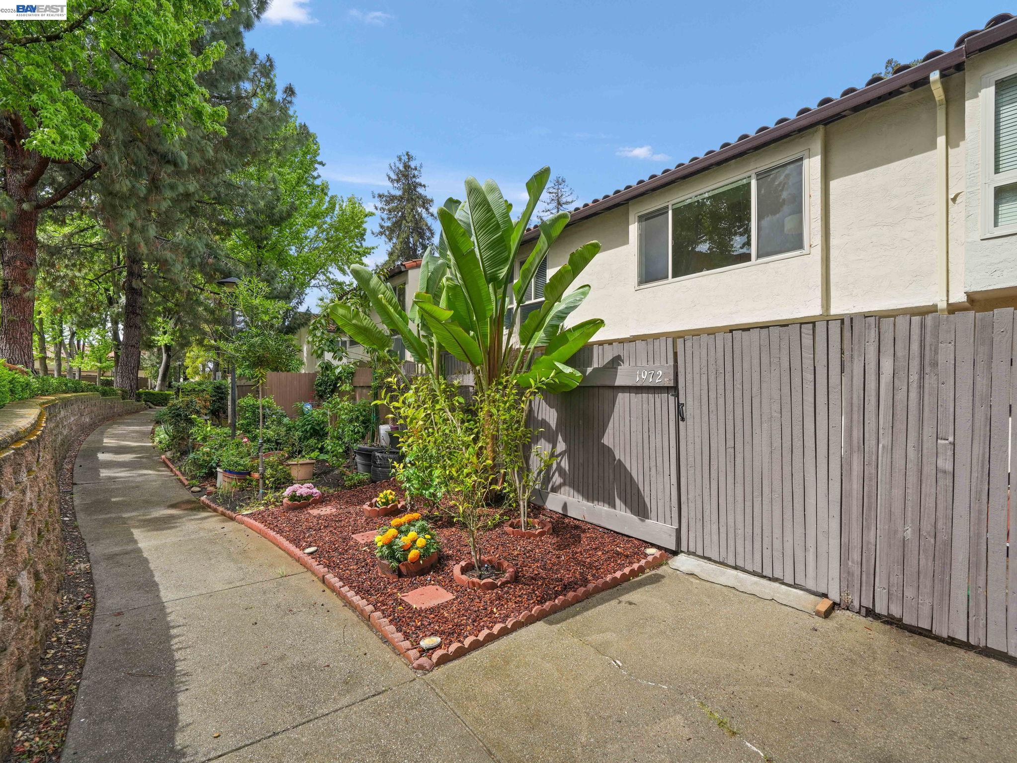 1972 Briscoe Terrace Fremont, CA 94539 - Photo 23 of 27 a front view of a house with a yard