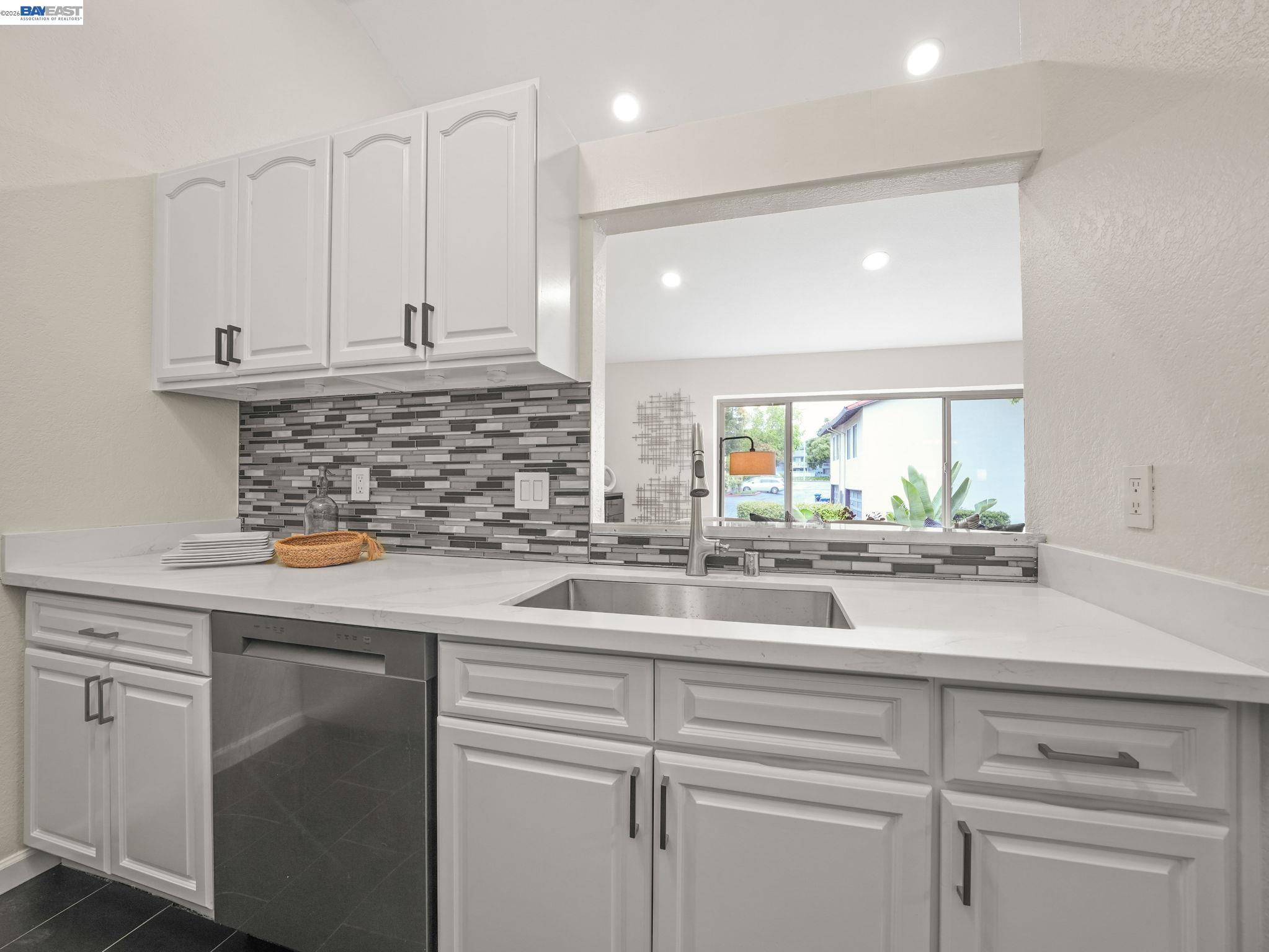 1972 Briscoe Terrace Fremont, CA 94539 - Photo 7 of 27 a kitchen with stainless steel appliances white cabinets and a sink