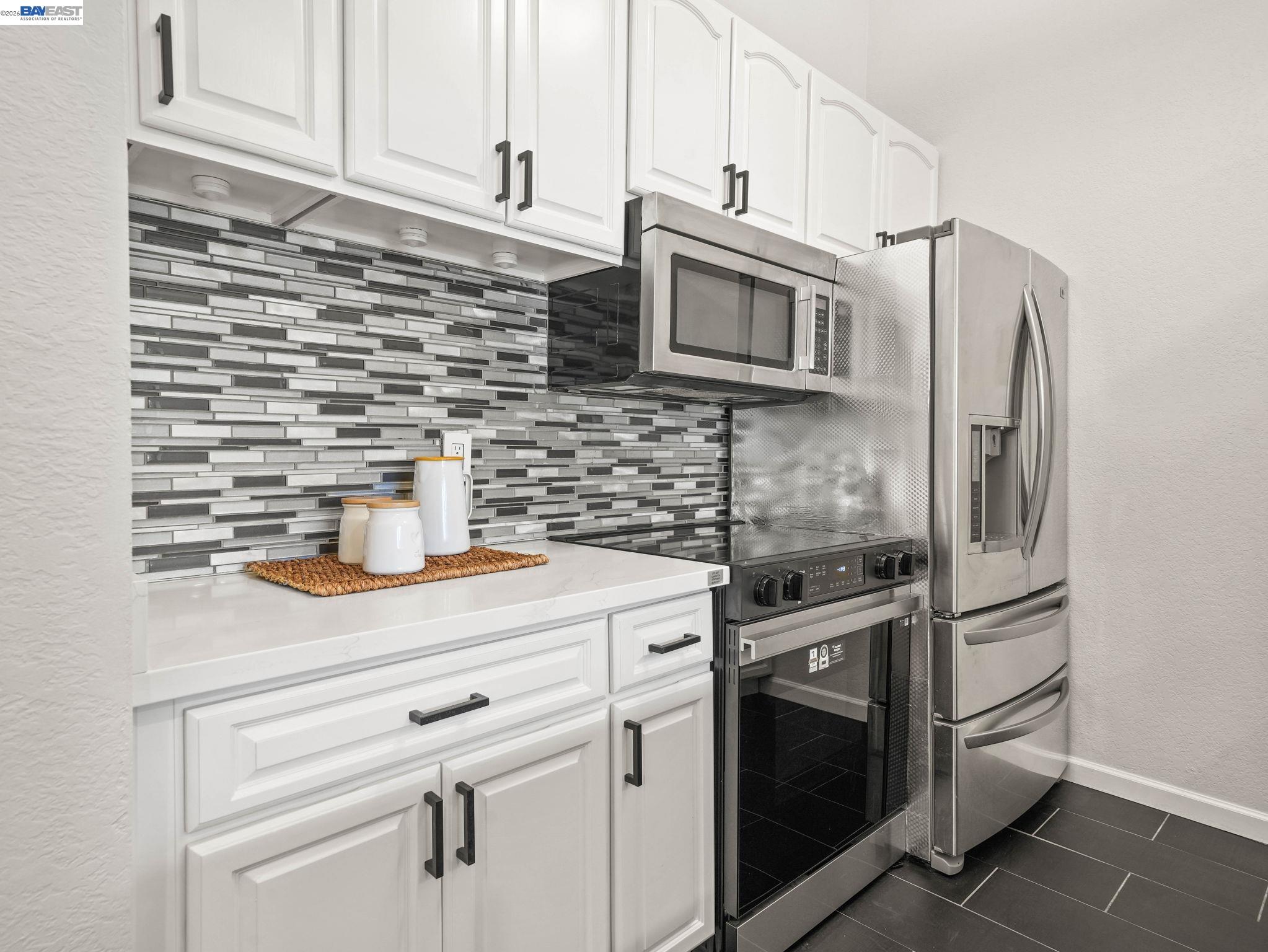 1972 Briscoe Terrace Fremont, CA 94539 - Photo 8 of 27 a kitchen with cabinets stainless steel appliances and a counter space