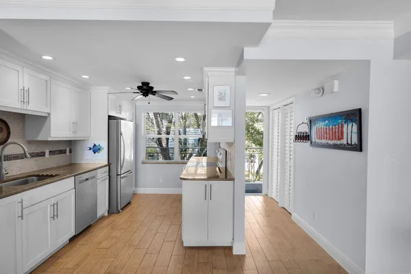 a bedroom with a bed and large window