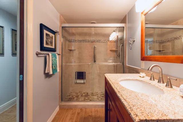 a bathroom with a bathtub shower sink and toilet
