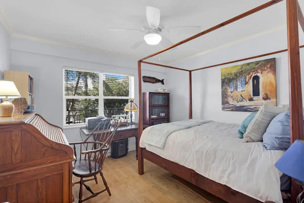 a bathroom with a granite countertop sink a mirror and shower