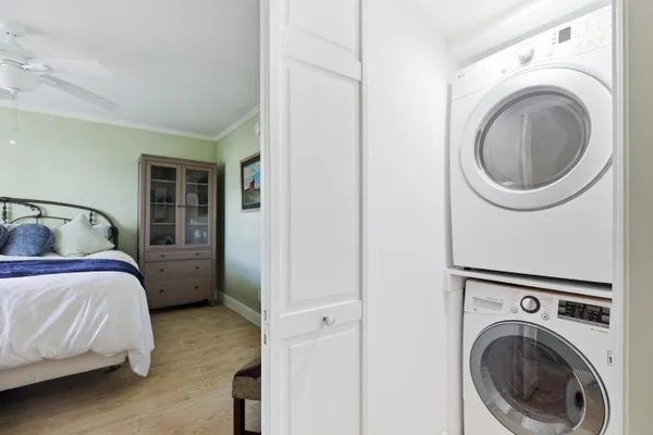 a dining room with furniture and a floor to ceiling window