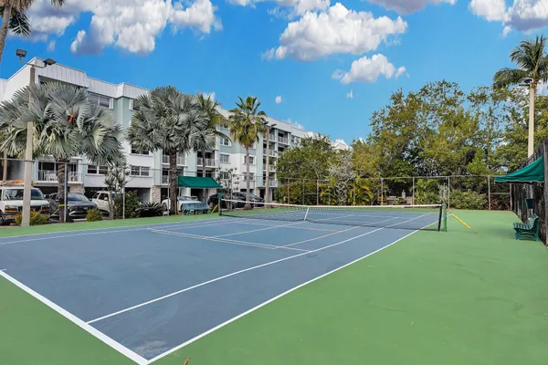 a view of a swimming pool with outdoor seating