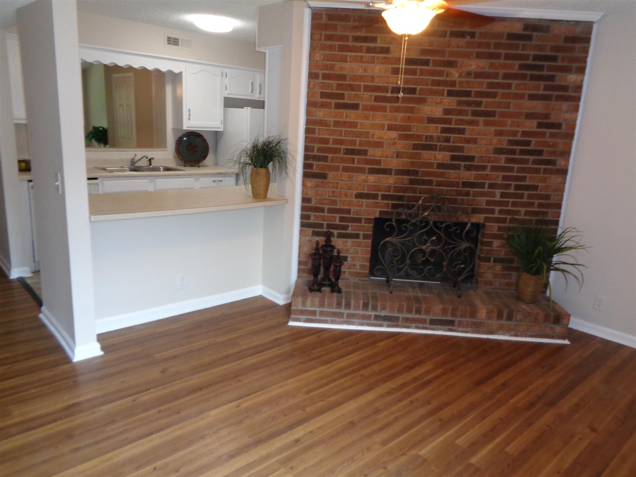 4001 Anderson Road, Unit I55 Nashville, TN 37217 - Photo 2 of 15 The den features a cozy wood-burning fireplace.