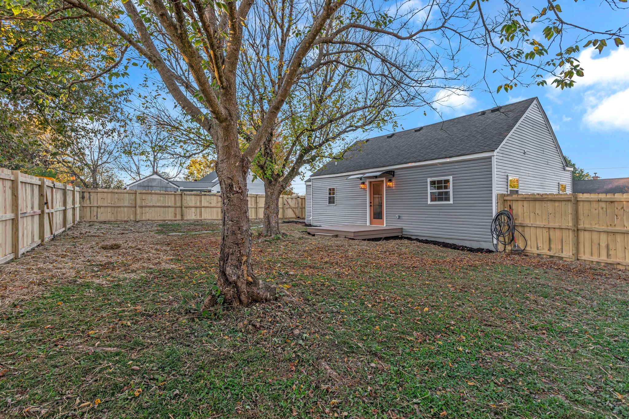 755 Center Street Lewisburg, TN 37091 - Photo 21 of 24 a backyard of a house with plants and large tree