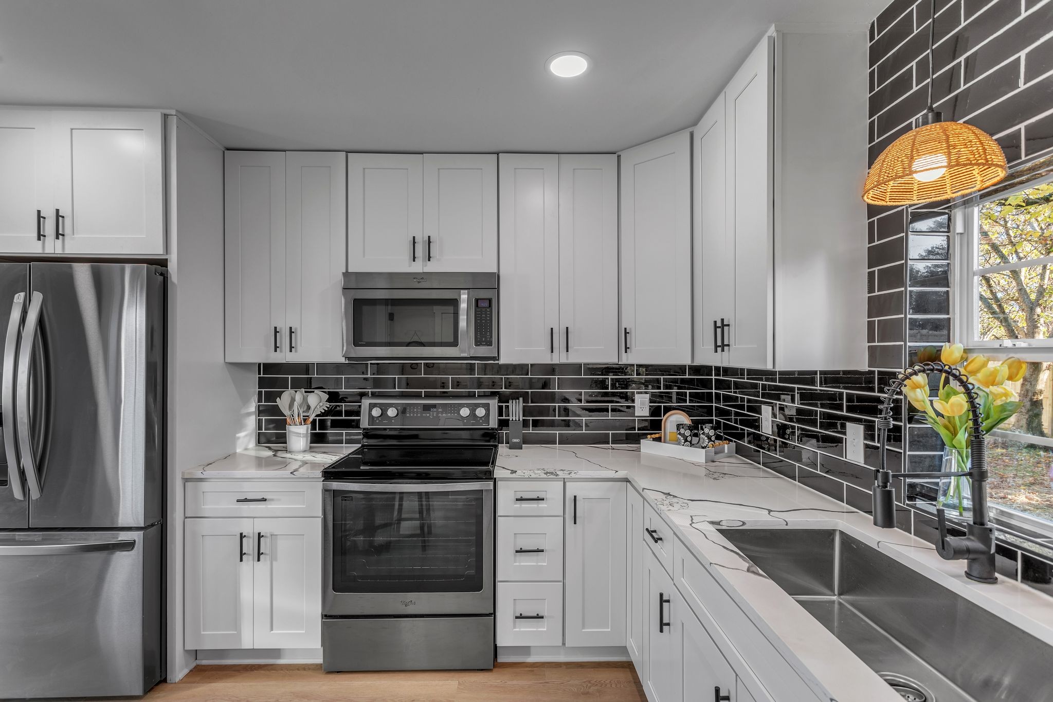 755 Center Street Lewisburg, TN 37091 - Photo 9 of 24 a kitchen with stainless steel appliances a stove sink and refrigerator