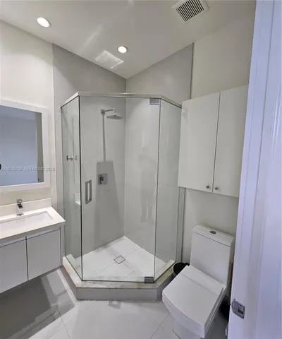 a bathroom with a tub toilet and a sink