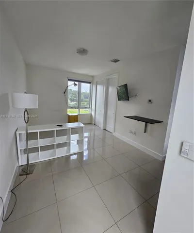a view of a livingroom with furniture and window