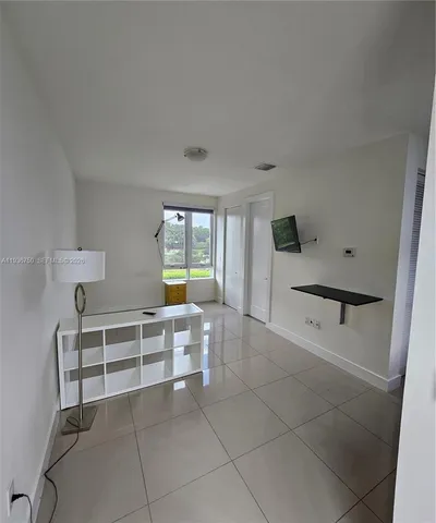 a view of kitchen with furniture and window