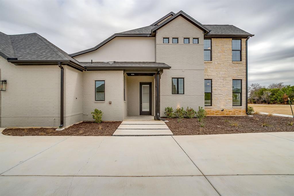 456 Acorn Trail Granbury, TX 76049 - Photo 11 of 40 a front view of a house with garden