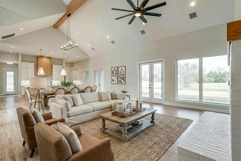 456 Acorn Trail Granbury, TX 76049 - Photo 16 of 40 a living room with furniture and a large window