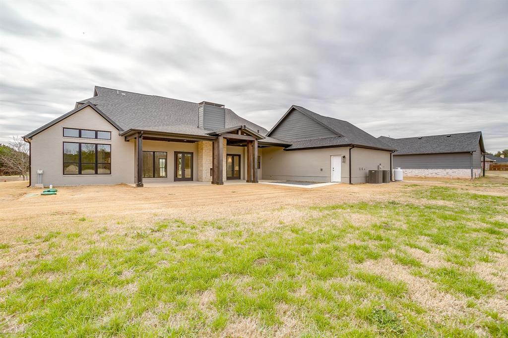 456 Acorn Trail Granbury, TX 76049 - Photo 37 of 40 a house with swimming pool in front of it