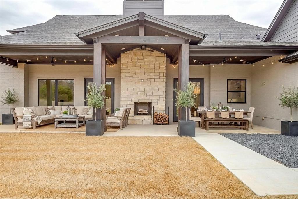 456 Acorn Trail Granbury, TX 76049 - Photo 7 of 40 a view of a livingroom with furniture and a fireplace