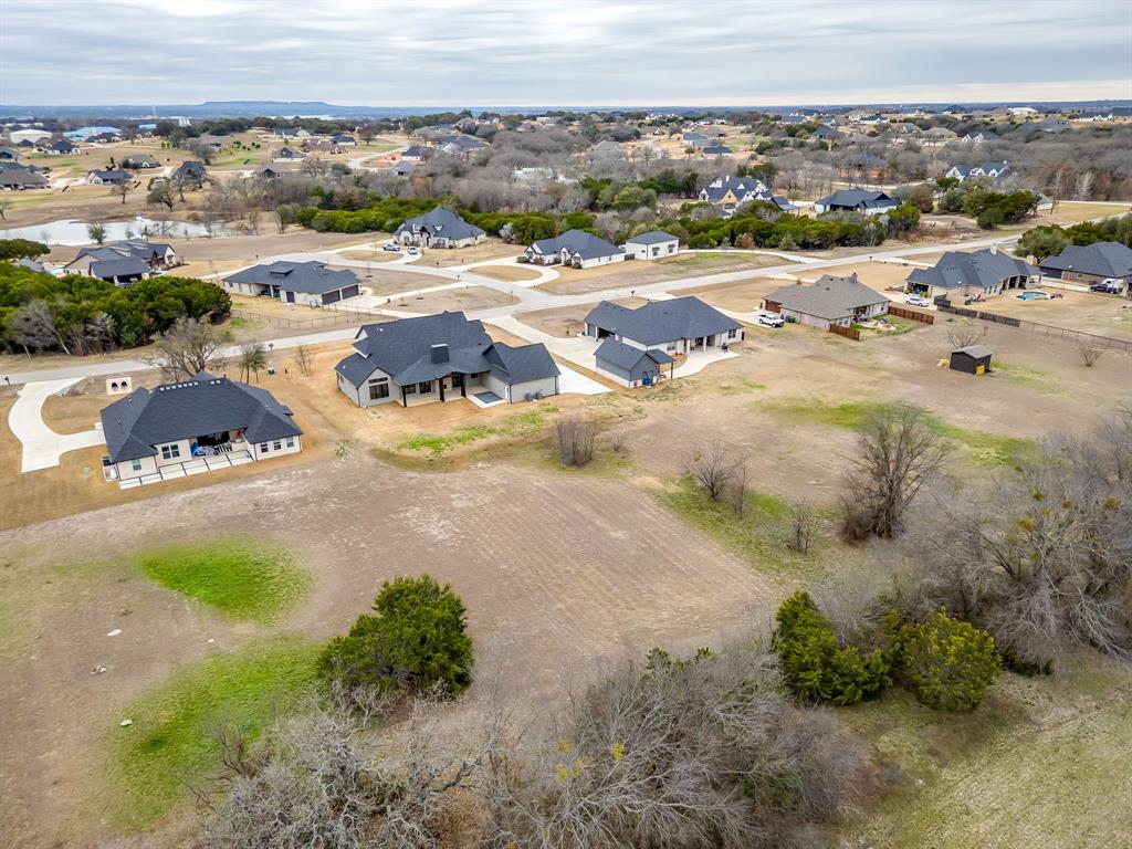 456 Acorn Trail Granbury, TX 76049 - Photo 8 of 40 an aerial view of residential houses with outdoor space