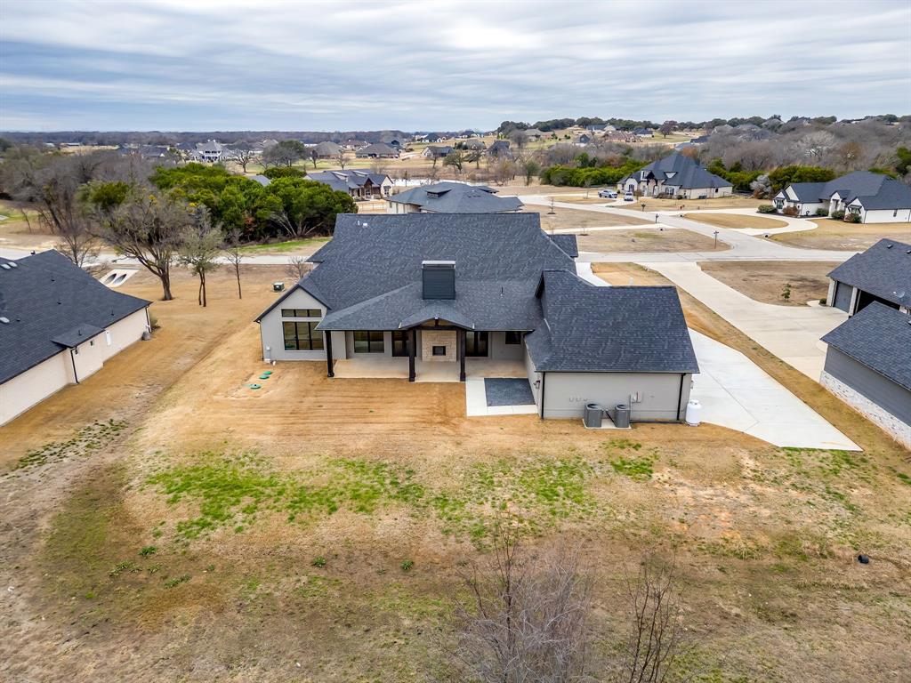 456 Acorn Trail Granbury, TX 76049 - Photo 9 of 40 an aerial view of a house with a yard lake view and mountain view