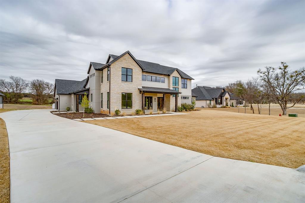 456 Acorn Trail Granbury, TX 76049 - Photo 10 of 40 a front view of a house with a yard