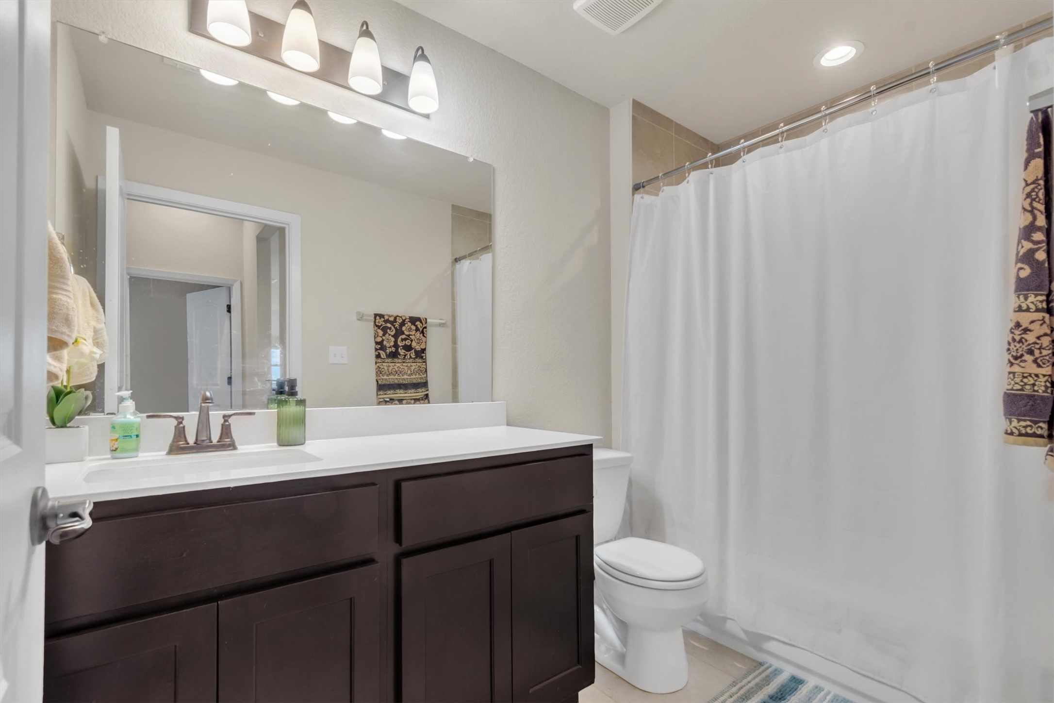 460 Delta Crest Maxwell, TX 78656 - Photo 15 of 18 Full bath with vanity, recessed lighting, and light tile patterned floors