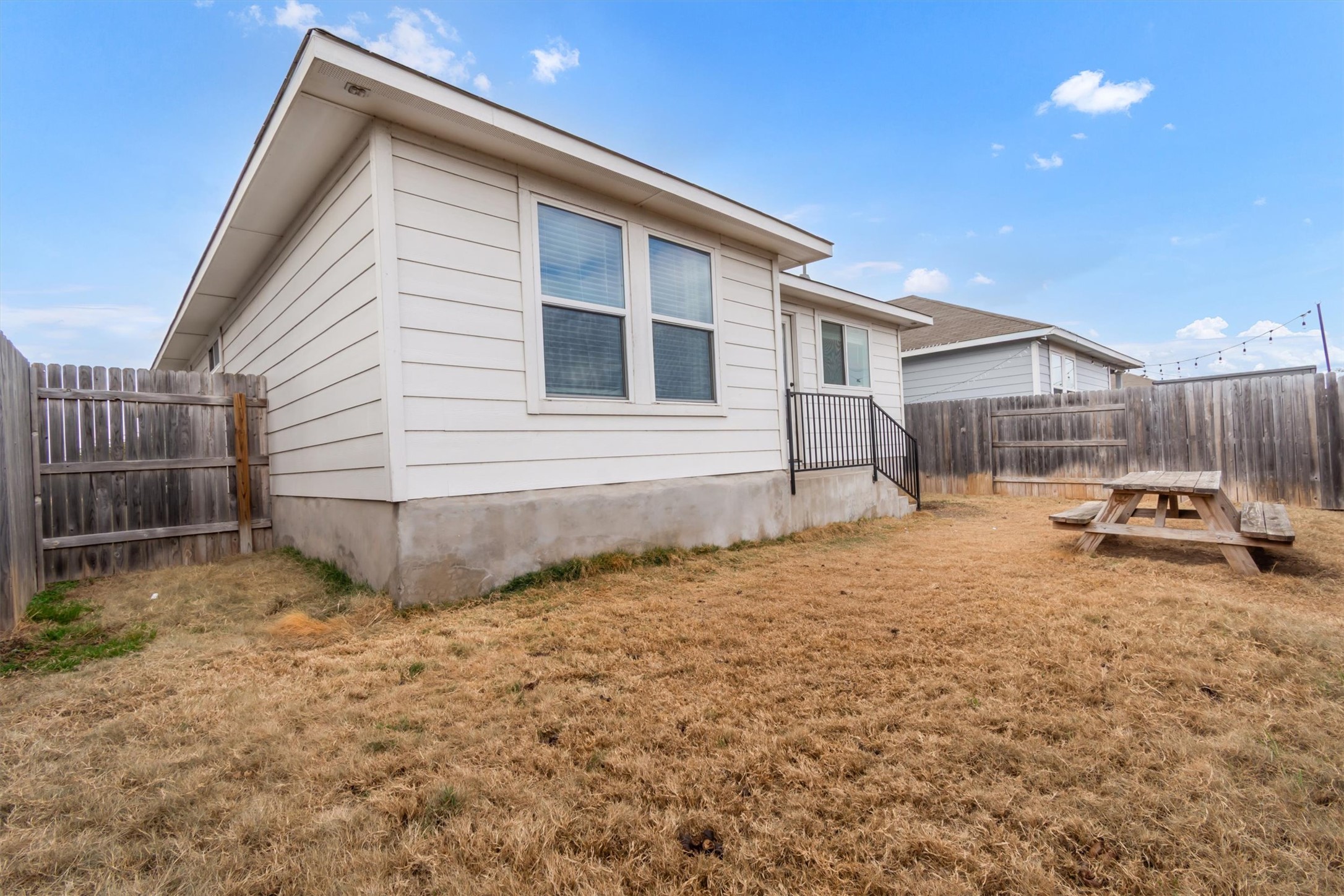 460 Delta Crest Maxwell, TX 78656 - Photo 16 of 18 Rear view of house featuring a fenced backyard